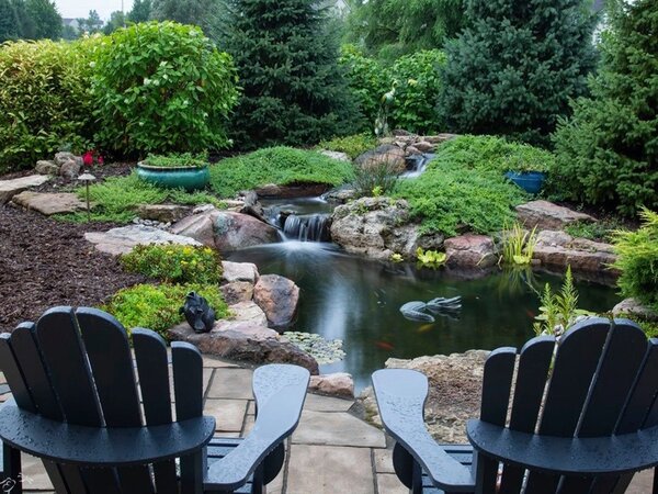 Large pond with patio beside it