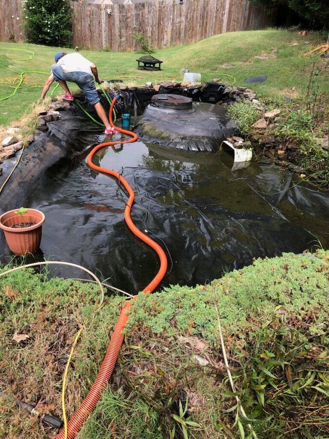 Cleaning pond with pump