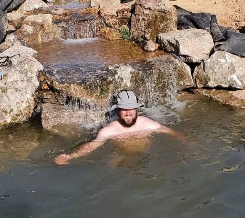 Man enjoying a swimming pond